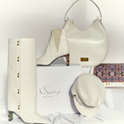 Yve set consisting of handbag, baker boy cap, ankle boots, and high-top boots in cream
